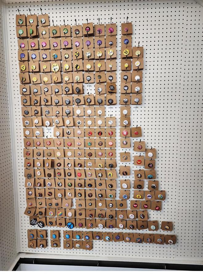 A pegboard grid of hundreds of buttons.