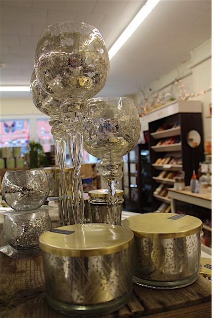Blown glass globes and candles in the store.