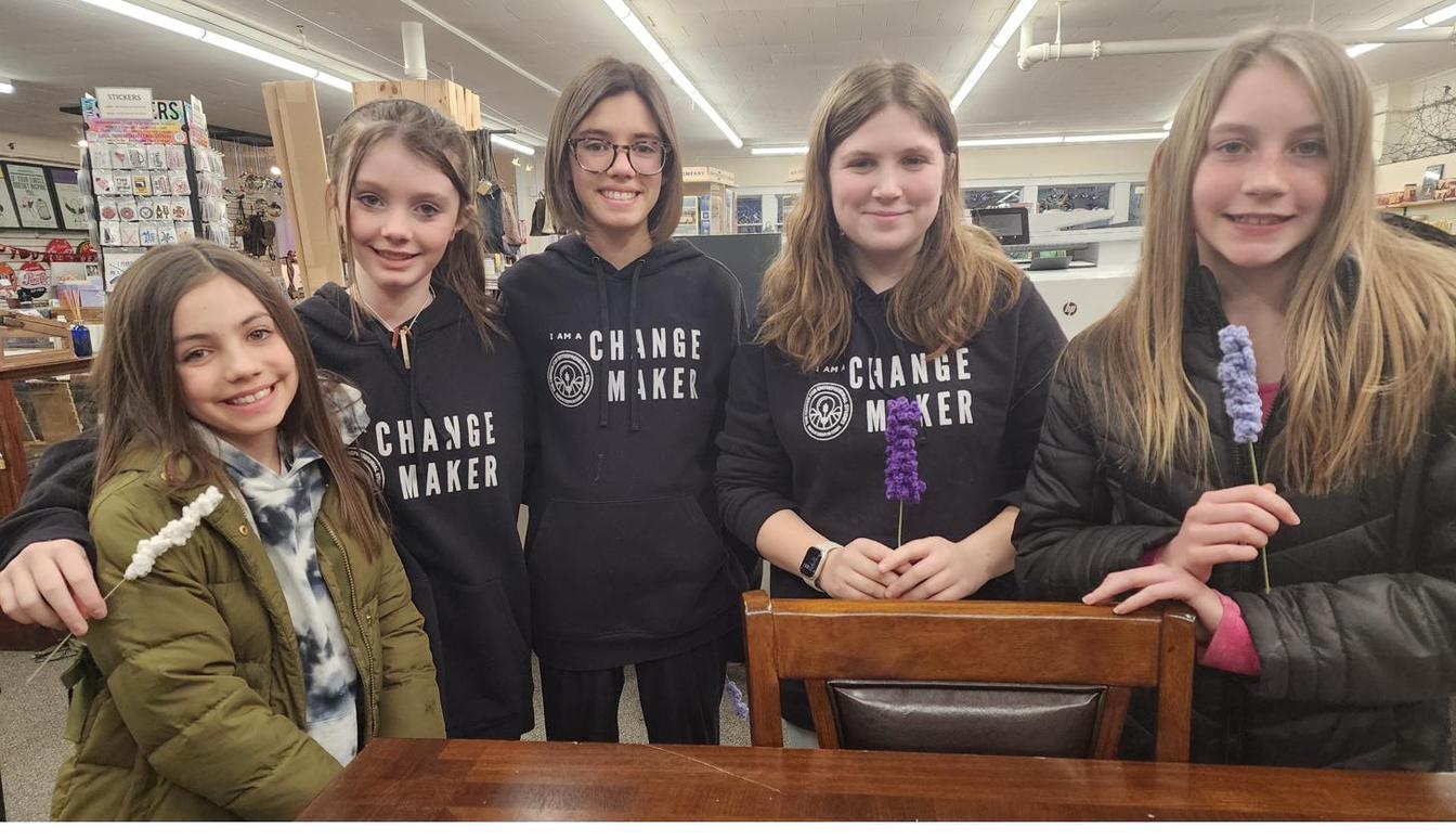 Five young people in Changemaker hoodies at CES.